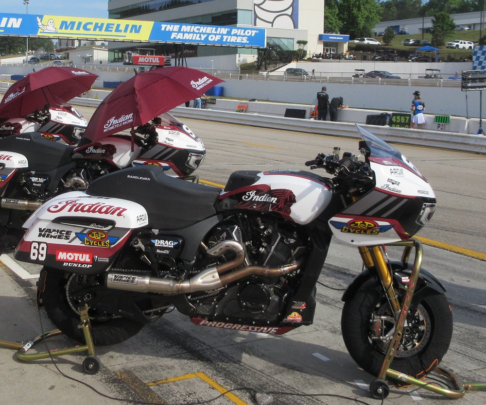 three factory Indian race bikes in the pits at Road Atlanta
