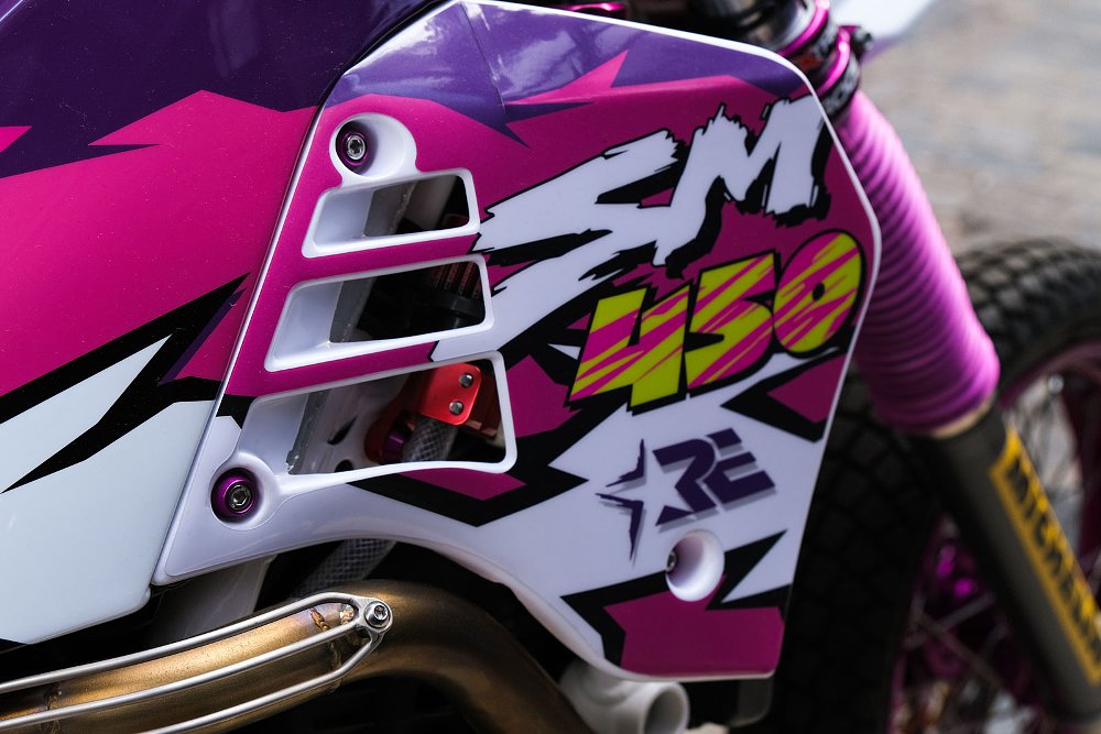 view of side and fuel tank with purple and pink graphics