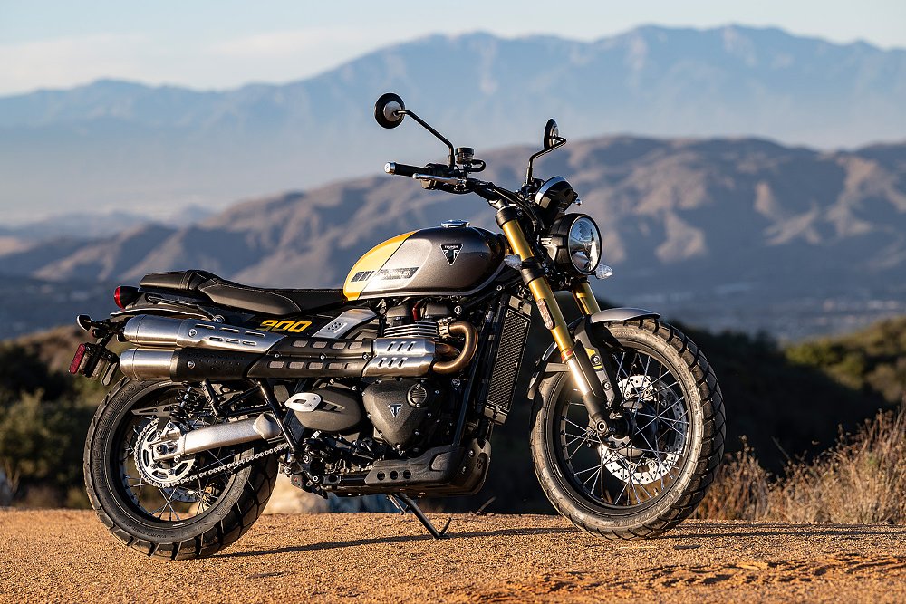 The Scrambler 900 captured with a mountain range in the background.