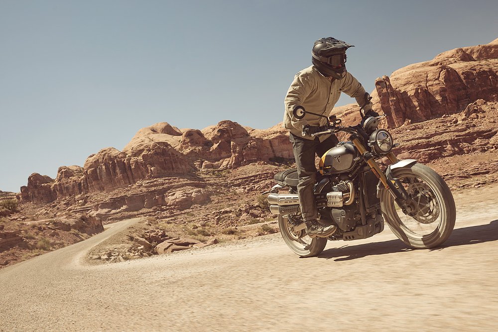 A Scrambler 900 rider explores an off-road trail.